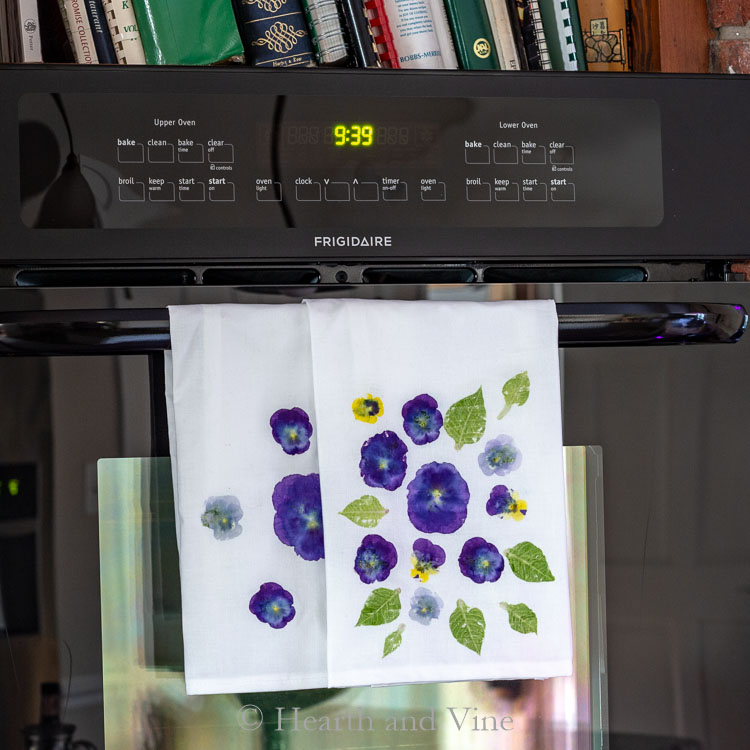 Flower pounded tea towels on oven door