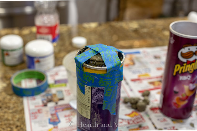 tape on top of can to hold down inner can
