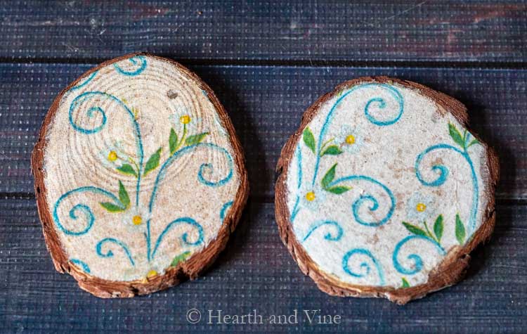 Two decoupaged coasters with different napkin thickness