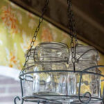 Hanging rustic 5 mason jar basket chandelier.