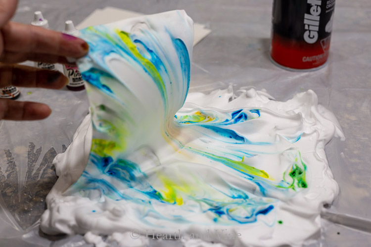 Lifting card out of shaving cream with alcohol inks