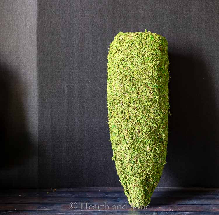 Moss covered cone shaped planter