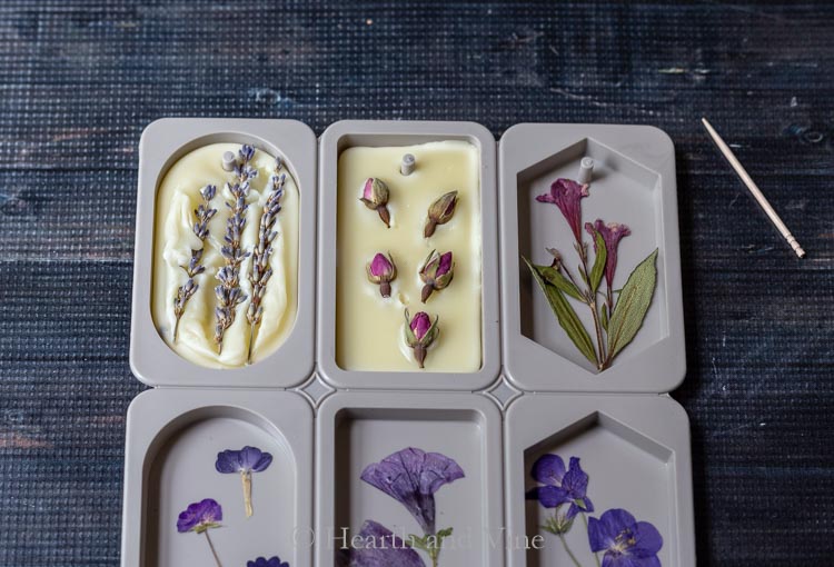 Pressed flowers and wax in molds