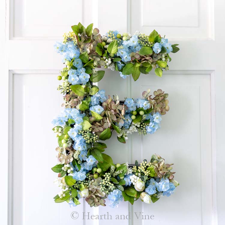 Floral letter E on door