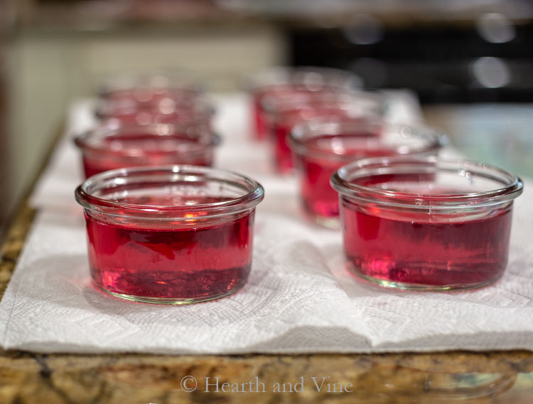 freshly poured jelly into jars