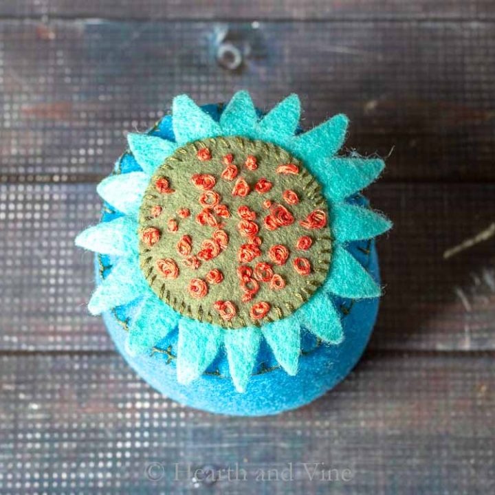 Felt flower pincushion with embroidery