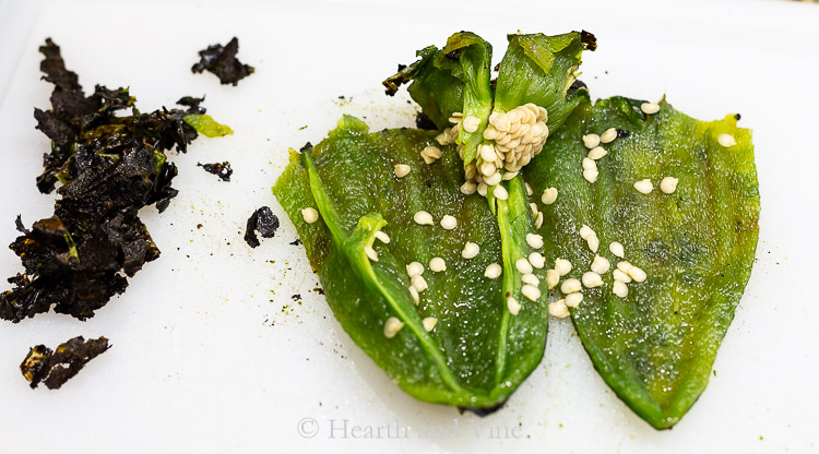 charred skin, seeds and tops of peppers