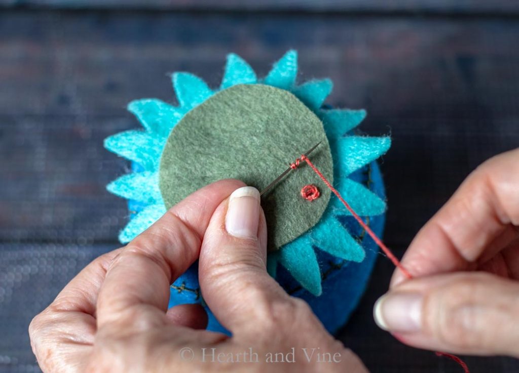 Attaching flower top with French knots
