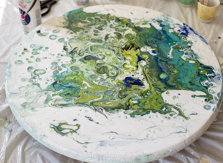 Edge of wood tray with acrylic pour paints