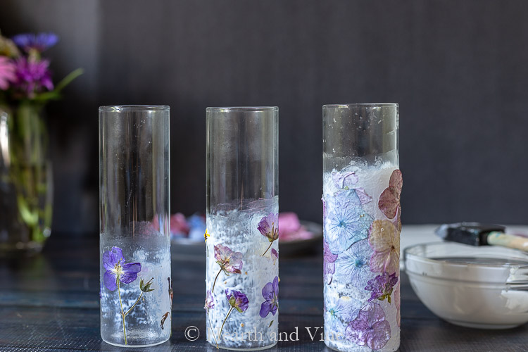 Three vases with pressed flowers and mod podge