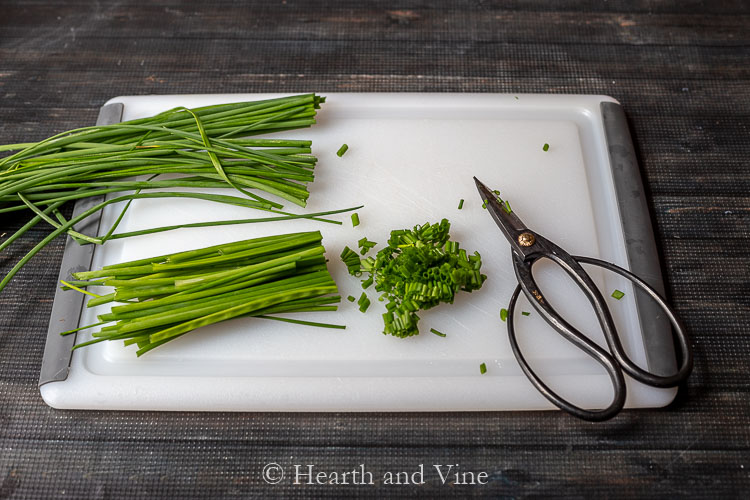Chopped chives on cutting board