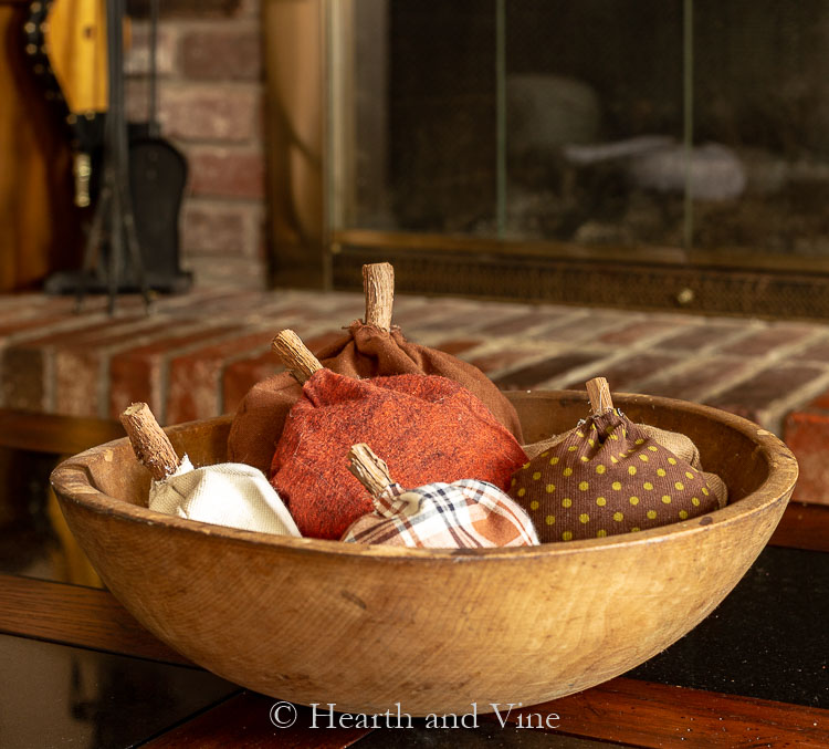 Bowl of fabric pumpkin sachets on coffee table