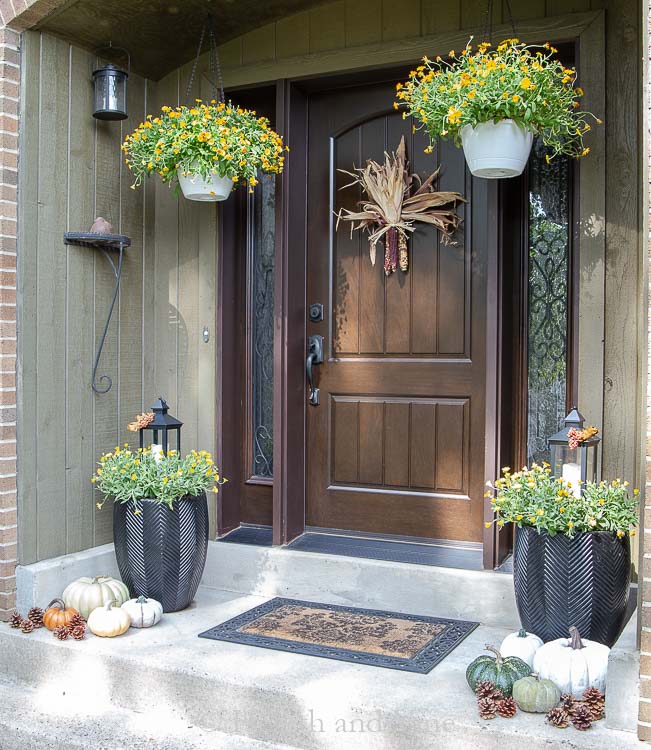 Front porch decorated for fall