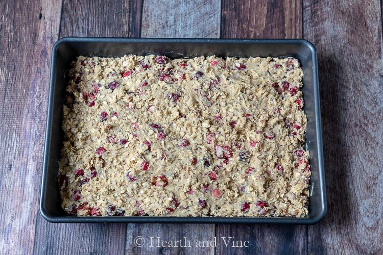 Cranberry oatmeal bar batter spread into a pan