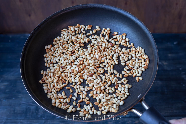 Roasted pine nuts in a pan