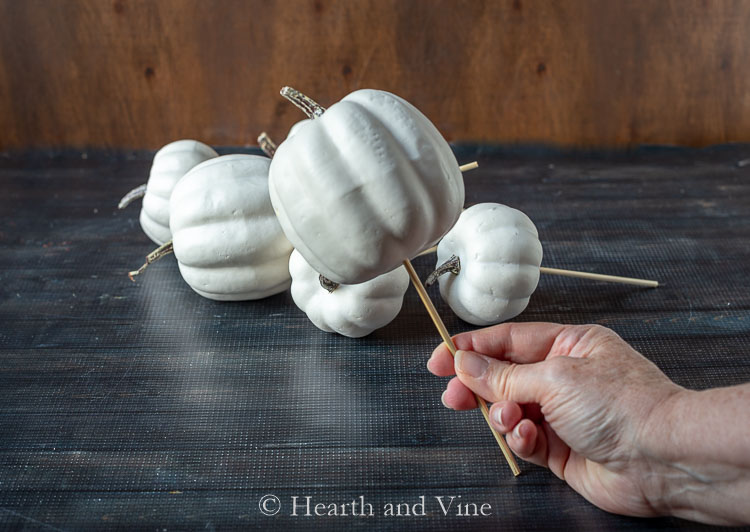 White craft pumpkin on skewer
