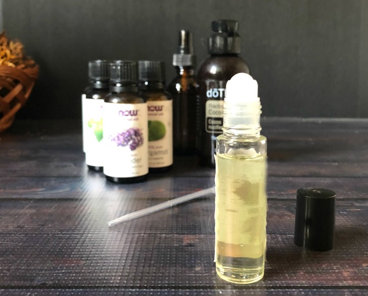 Roll on bottle with essential oils to create perfume oil