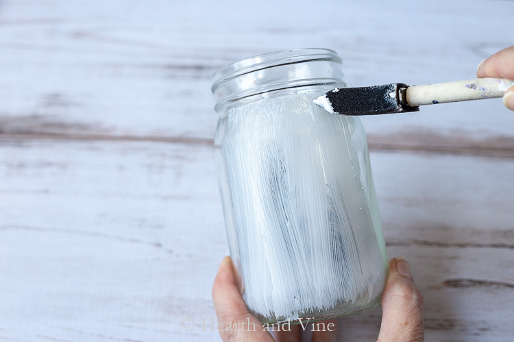 Painting glue on mason jar