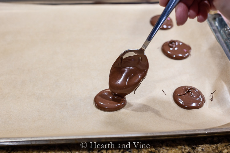 Spooning chocolate onto parchment