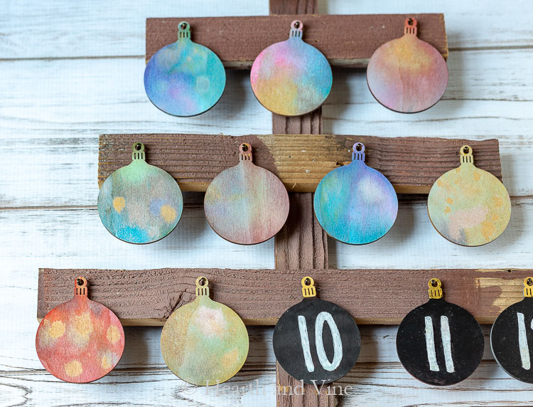 Mix of colored ornaments and number ornaments on advent tree