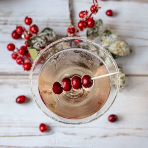 Berry martini glass with cranberries on a toothpick