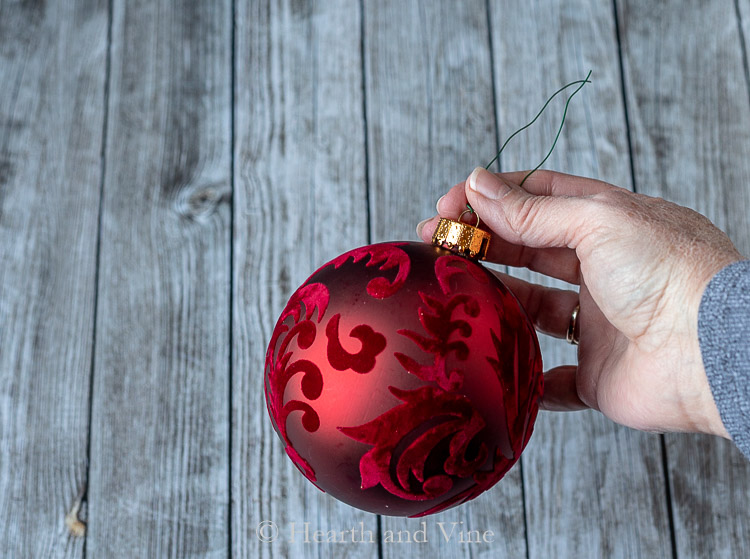 Red ball ornament with wire