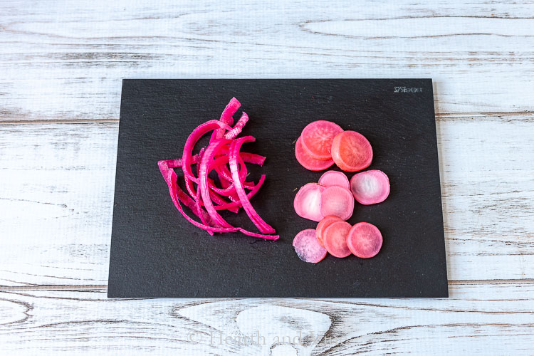 Pickles red onions and radishes