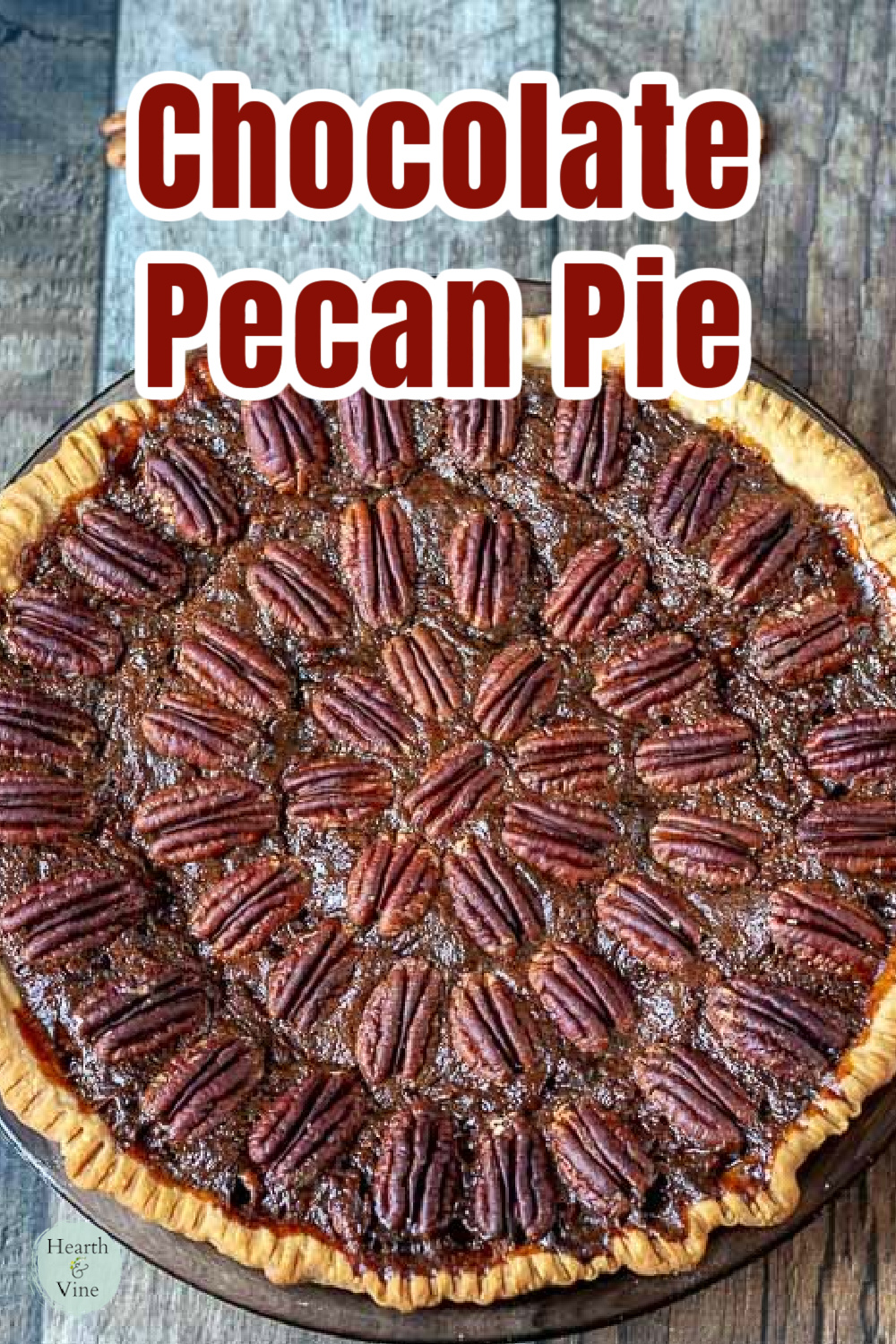 Chocolate pecan pie with pecan halves decorating the entire top.