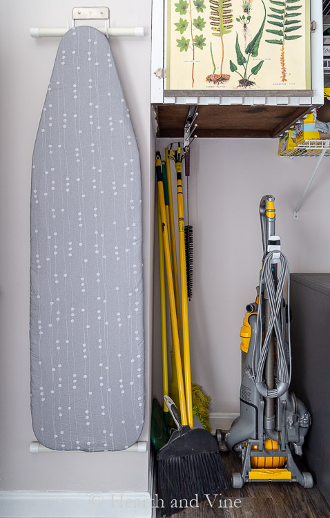 Ironing board with new gray cover.