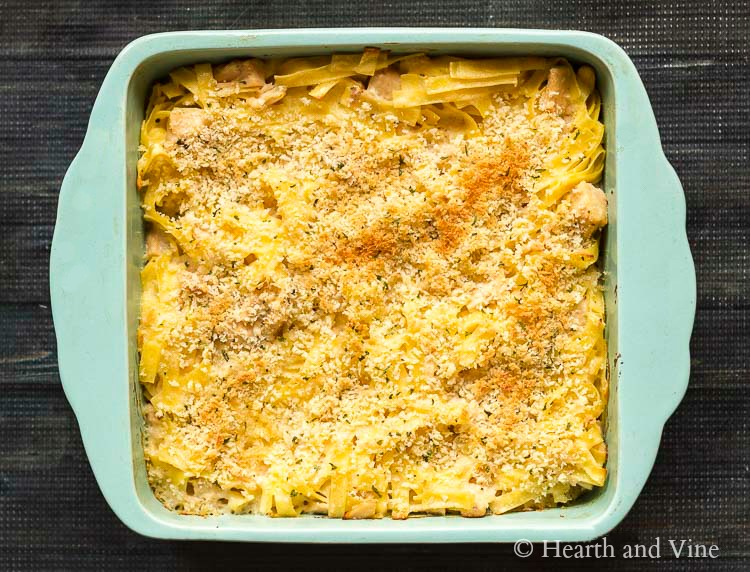 Tuna noodle casserole in a square ceramic baking dish.