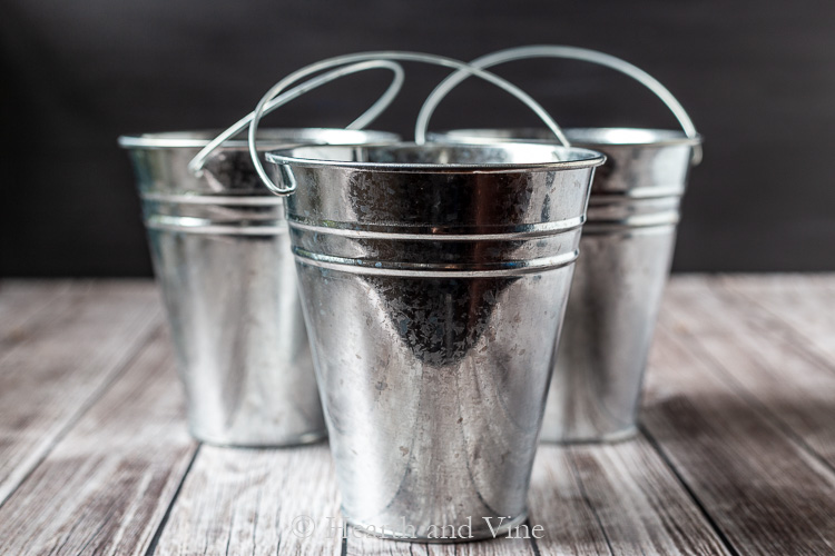 Shiny metal pots with handles