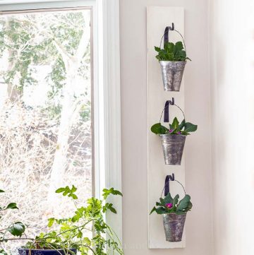 Hanging wall planter with galvanized pots