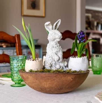 Easter bunny, eggs, flowers in dough bowl