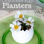 Easter place setting with clay egg planter and flowers