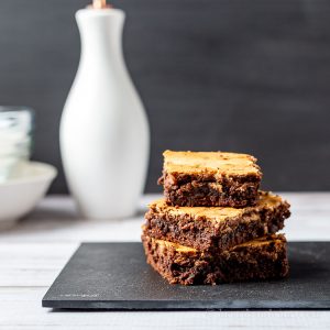 Chocolate cheesecake brownies stacked