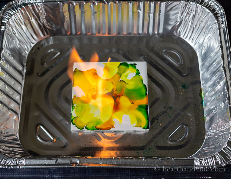 Setting alcohol ink tile on fire.