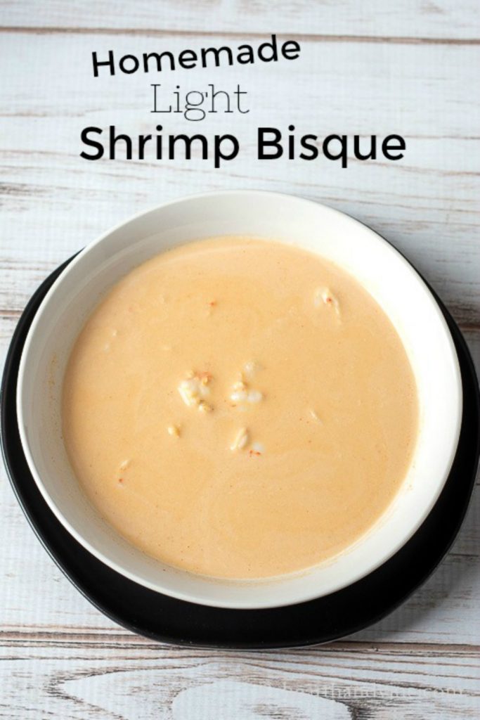 Bowl of shrimp bisque with text overlay "Homemade Light Shrimp Bisque"