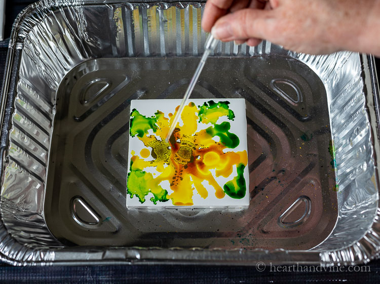 Add in rubbing alcohol ink to the tile.