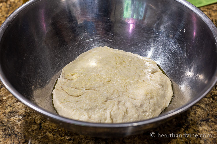 Focaccia dough rising in a bowl