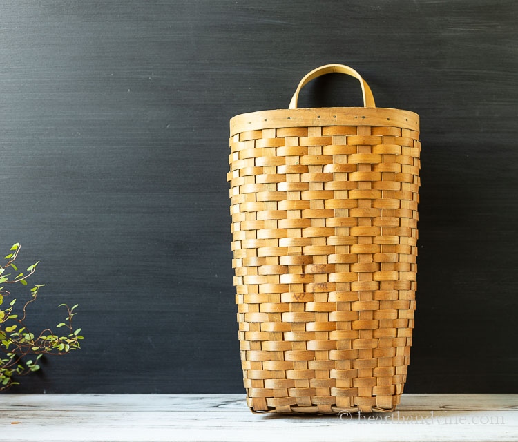 Old tall orange wood basket