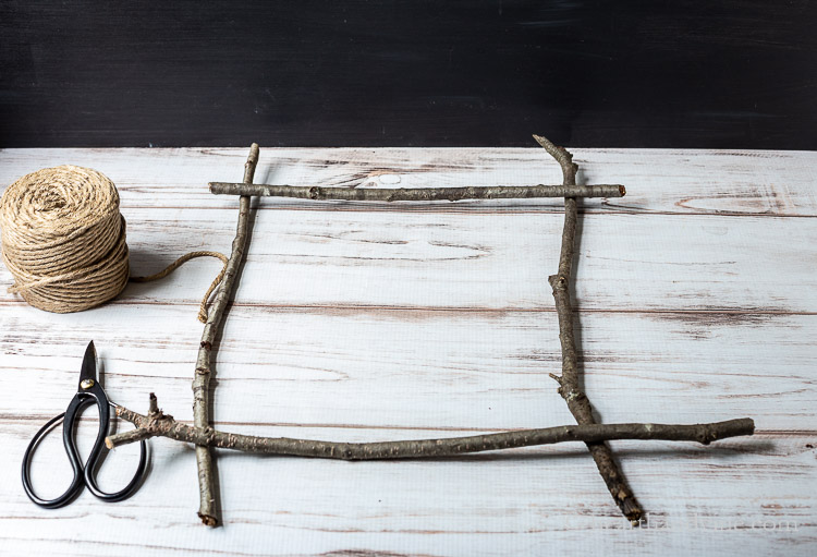 Laying out sticks to make a frame.