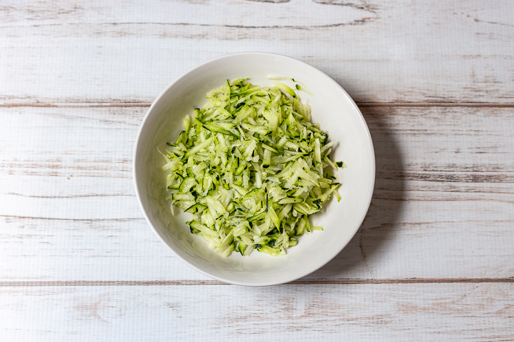 Shredded zucchini in bowl