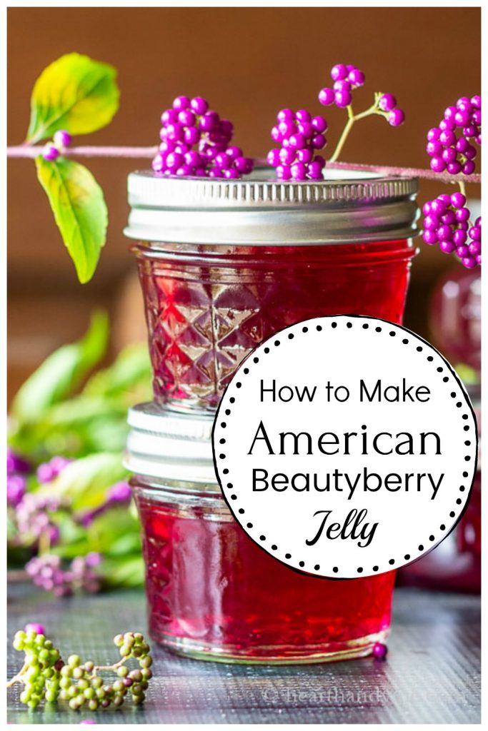 Stacked jars of beautyberry jelly with a branch of the beautyberry shrub on top.