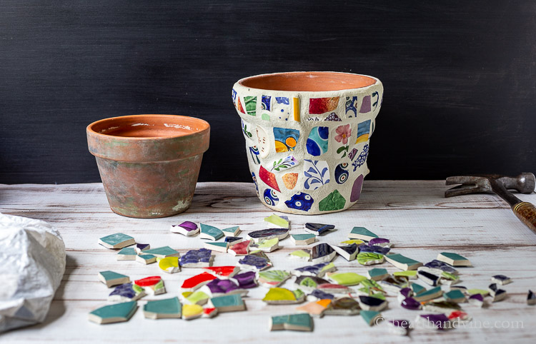 Old terra cotta pot, mosaic pot and broken pieces of ceramics.