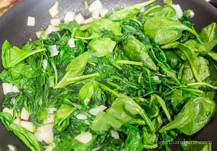 Sauteed spinach leaves and onions.