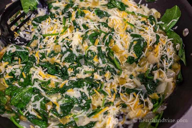 Spinach enchilada filling in a pan