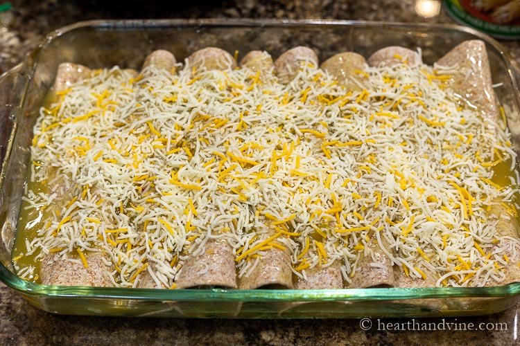 Pan of spinach enchiladas before baking.
