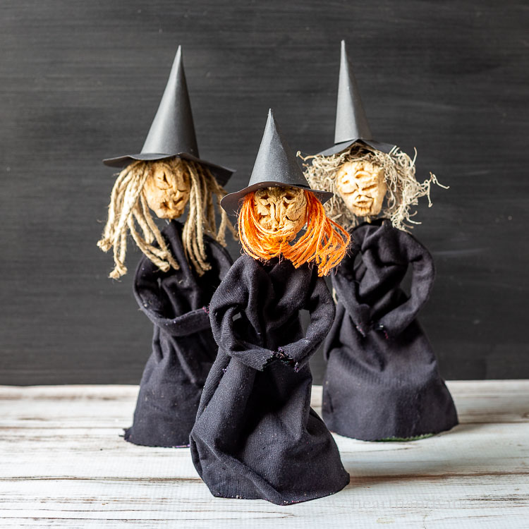 Three apple head doll witches