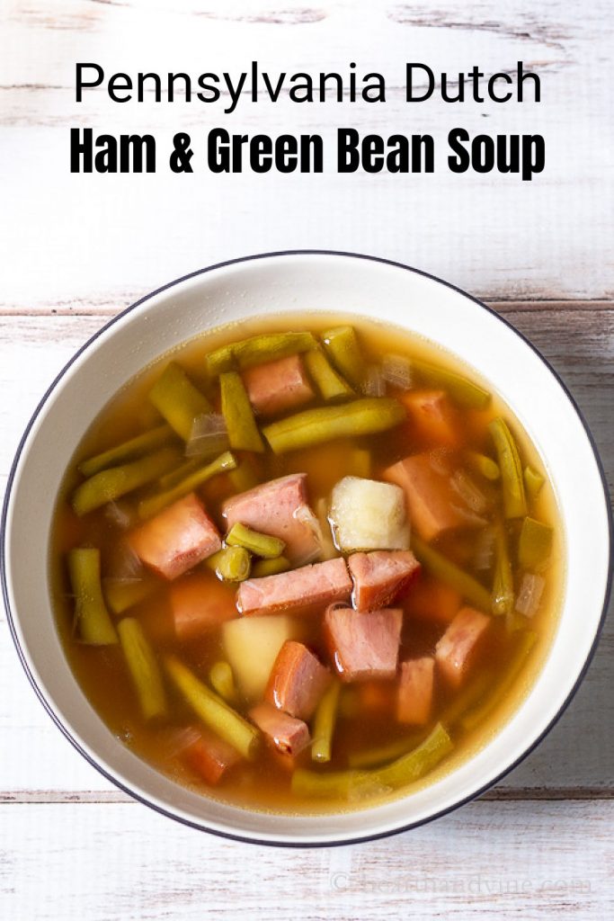 Aerial view of ham and string bean soup in a serving bowl.