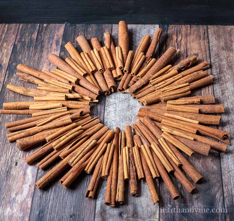 Cinnamon stick wreath lying on a table.
